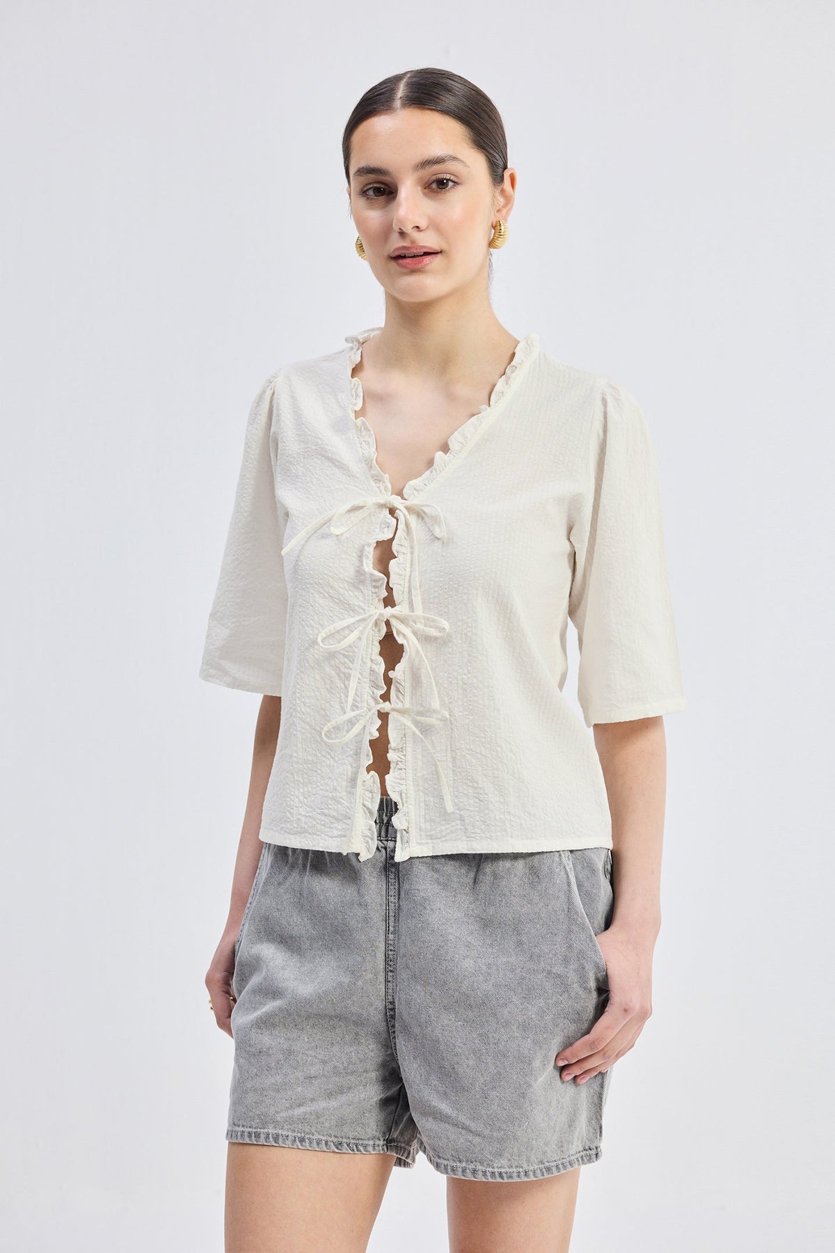 Relaxed Fit Top With Ruffles and Front-Ties in Cream
